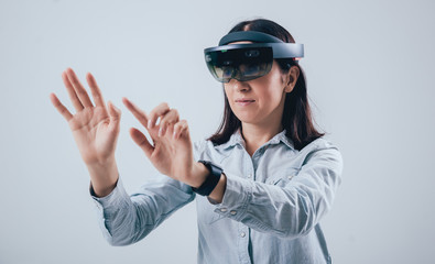 Woman wearing augmented reality goggles.