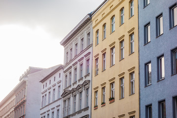 Fototapeta na wymiar some colorful houses in berlin with blurry sky
