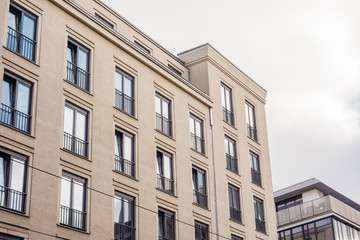 Fototapeta na wymiar white apartment building with residential facade