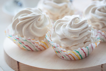 Breakfast with marshmallow or zephyr with a cup of coffee near Christmas poinsettia