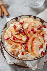 Coconut rice with pomegranate, pear and almond slices