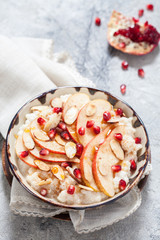 Coconut rice with pomegranate, pear and almond slices