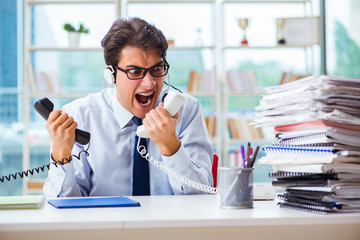 Unhappy angry call center worker frustrated with workload