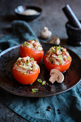 Tomatoes stuffed with rice, bacon, mushrooms, cheese and onion