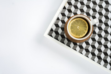 Simple minimalistic flat lay scene tea cup on a tray