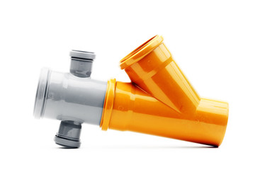 New grey and orange drain pvc pipe isolated on white