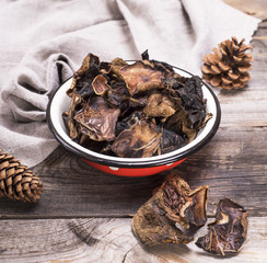 dry forest mushrooms in an iron plate
