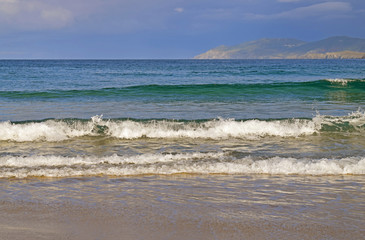 Shore of the beach with waves