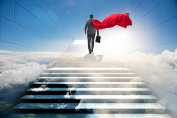 Businessman superhero successful in career ladder concept