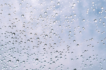 A lot of water droplets defocus bokeh abstract light background.