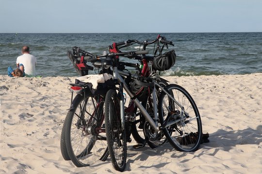 two bikes on sandy beach