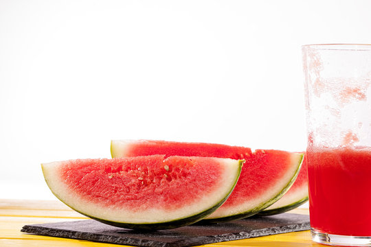 Fresh watermelon slices and juice drink. Thirst quenching refreshing summer vacation smoothie.
