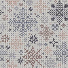 Seamless knitted pattern from gray and beige snowflakes