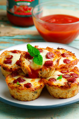 cauliflower pizza bites. selective focus