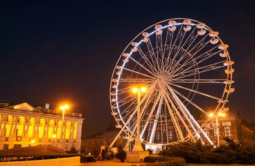 Construction and wagons of the  Ferris wheel at night  in Poznan.