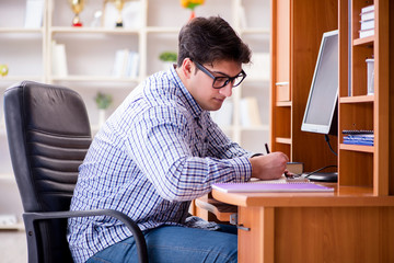 Young student at computer table