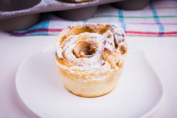 Homemade bun with apples close-up