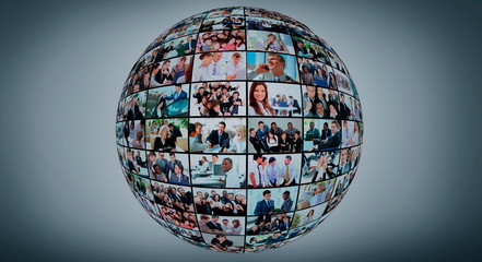 A globe is isolated on a white background with many different business people