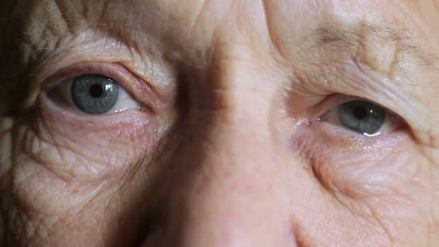 Eyes of an old woman crying