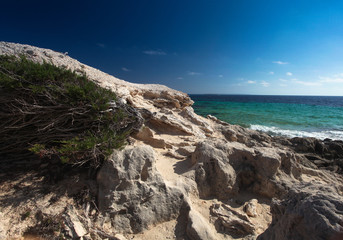 Fototapeta na wymiar Scales of Ibiza with the sea in the background