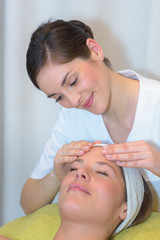 Fototapeta na wymiar young woman having a facial massage