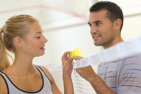 young couple playing badminton