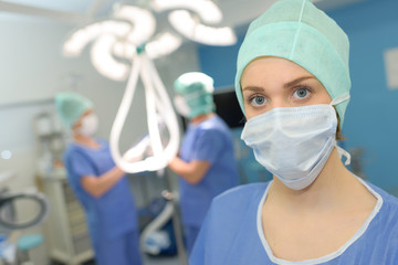 a surgeon posing