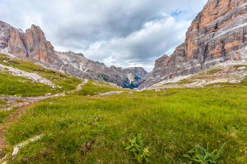 View of wild Travenanzes valley with Vallon Bianco and Furcia Rossa Mounts background, Dolomites, Italy