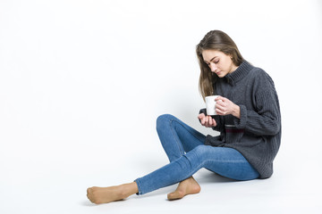 A girl with a hot mug of tea