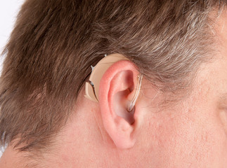 Close up of a senior man's ear with hearing aid