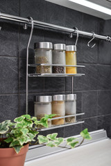 Jars of spices in hanging shelf