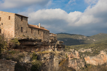 Stone house high on the mountain in Siurana. Beautiful landscape from high peak to climbing climbers and adventurers