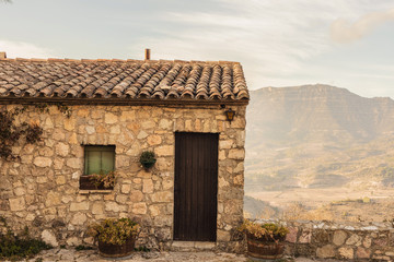 Stone house high on the mountain in Siurana. Beautiful landscape from high peak to climbing climbers and adventurers