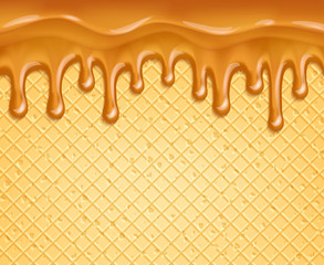 Caramel or honey flowing over waffle background