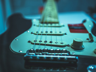 Fototapeta na wymiar macro shot of electric guitar strings and volume knob