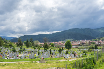 Fototapeta na wymiar Cemetery of a small town in Blagoevgrad region, Bulgaria