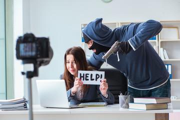 Criminal recording message for ransom with victim businesswoman