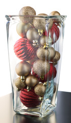 Christmas ball ornaments in glass jar for decoration.