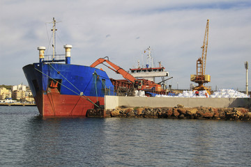 Merchant ship unloading at the dock
