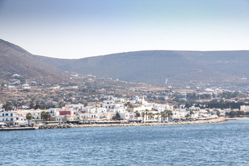 Fototapeta na wymiar View over a bay with a typical village on Paros, one of the Cyclade islands in Greece 
