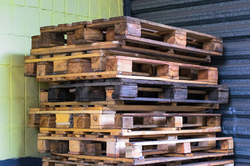 Old wooden pallets in the supermarket warehouse. Texture of pallets