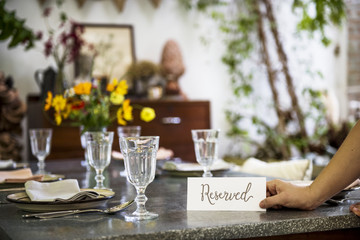 Restaurant table setting service with reserved card