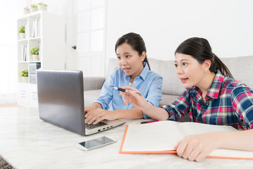 young sweet girls students looking laptop typing