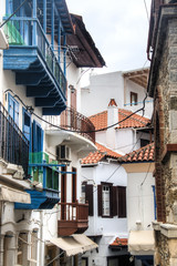 Fototapeta na wymiar A typical street with historical houses in Skopelos town on Skopelos island in Greece 