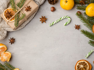 Winter hot chocolate drink in a Cup on a gray concrete background tangerines festive decorations Copy space