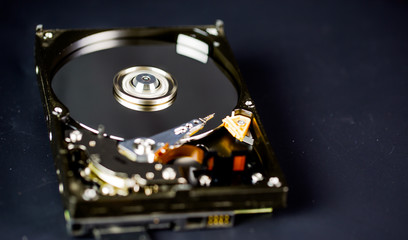 Obraz premium Disassembled hard drive from the computer, hdd with mirror effect Opened hard drive from the computer hdd with mirror effects Part of computer pc.