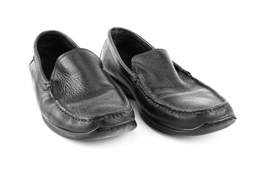 Black leather shoes isolated on white background with copy space.