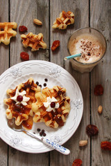 Waffles with whipped cream and berry jam