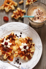 Waffles with whipped cream and berry jam