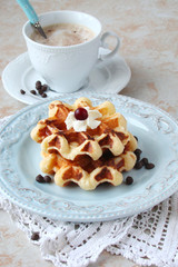 Waffles with whipped cream and berry jam